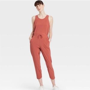 All In Motion Rust Woven bodysuit Size S